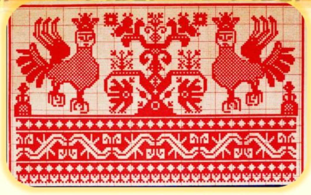Russian-Aryan Mother-Falcon with paws of a Lioness, Lioness’ ears and the Sun / Ra Crown on Russian embroideries of the Russian Far North.